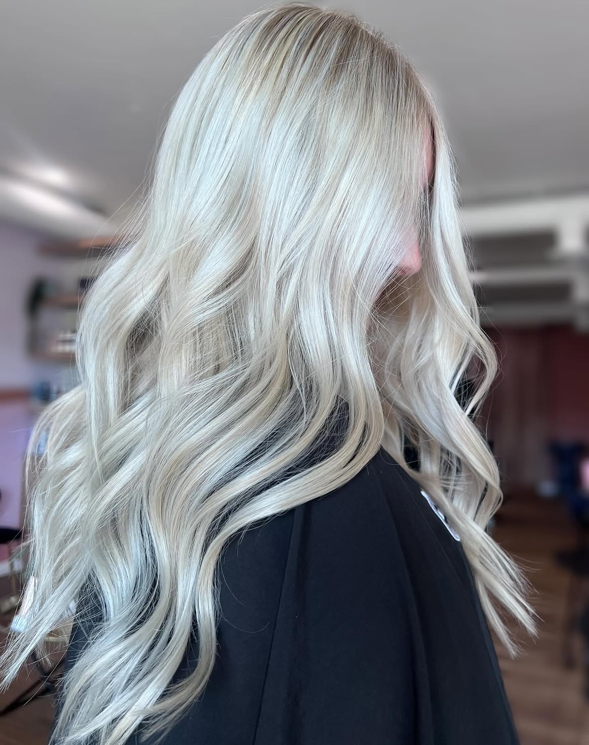 Icy Platinum Blonde Waves With Face Framing Layers