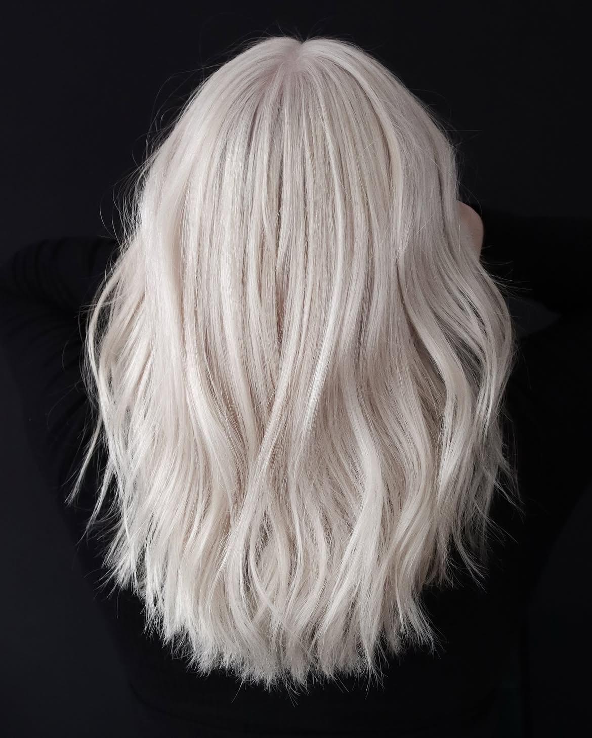 Icy Platinum Blonde Waves With Textured Ends
