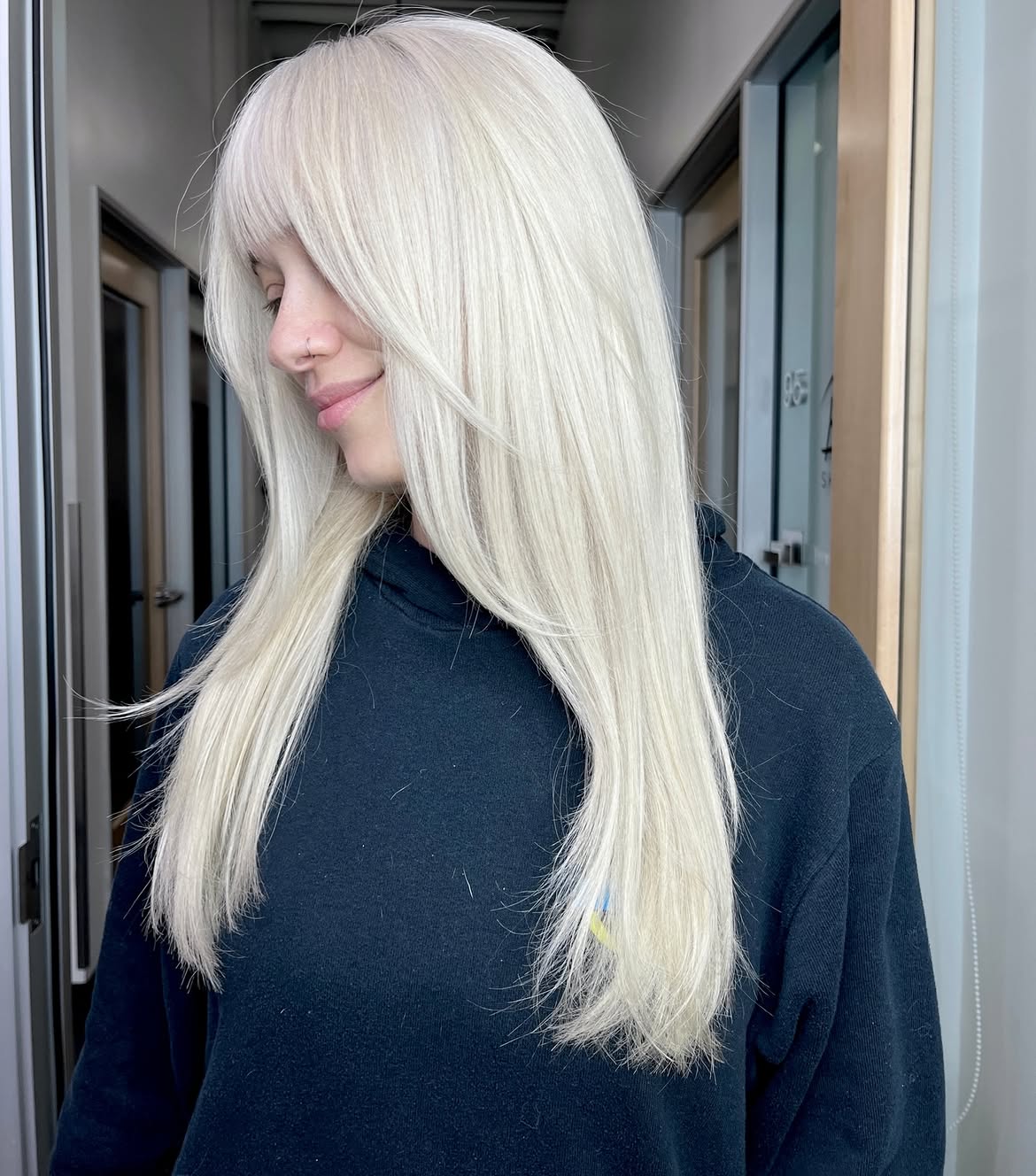 Icy Platinum Blonde With Long Face Framing Layers