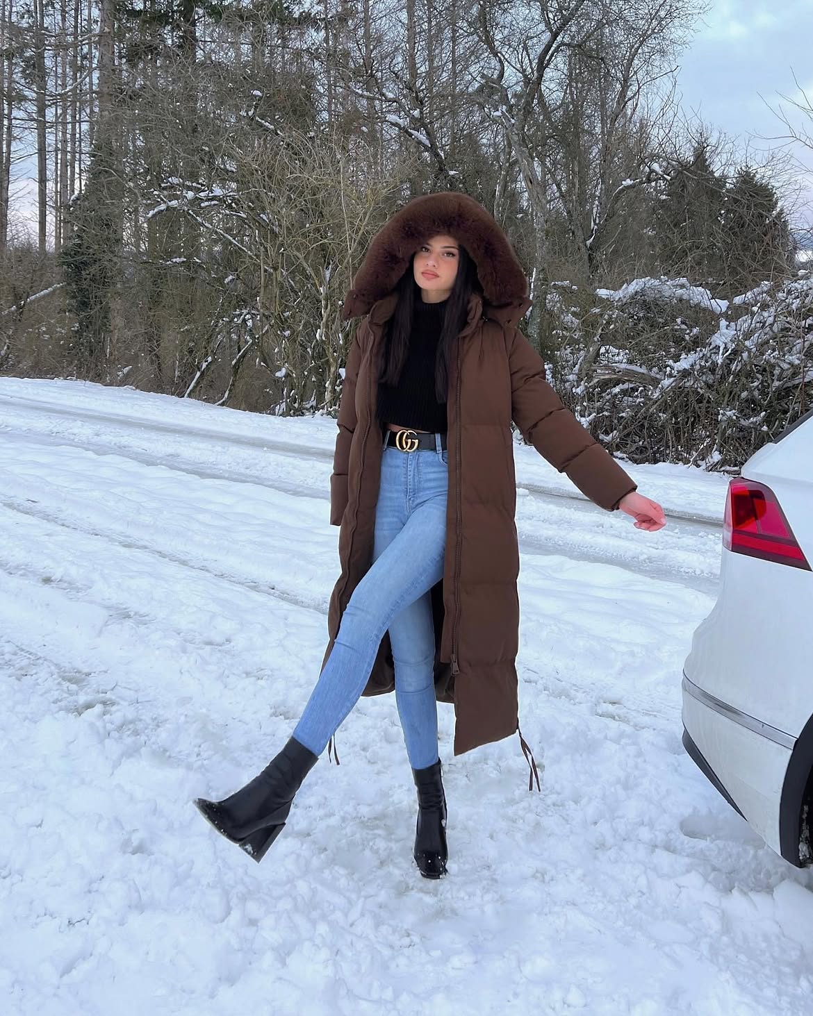 Long Puffer Coat With Light Wash Jeans Outfit