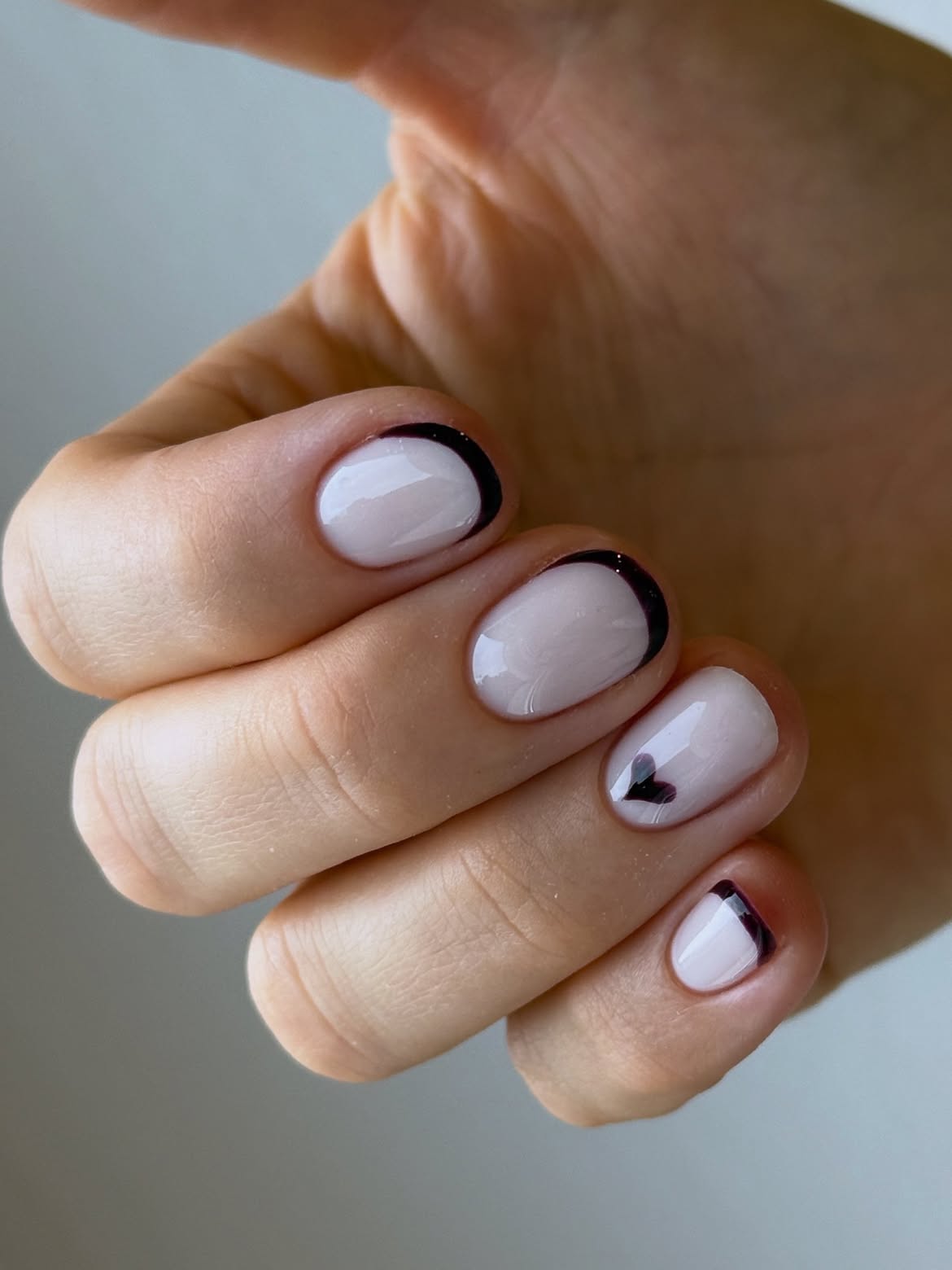 Milky White French Tips with Black Heart Accent