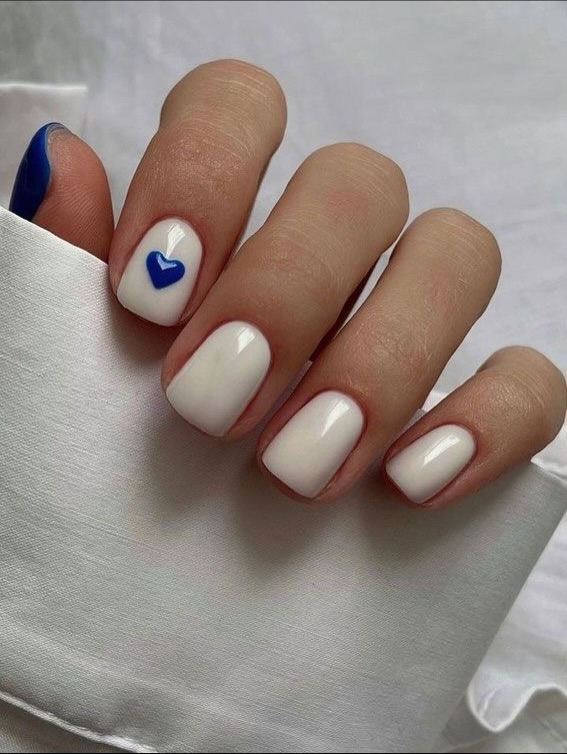 Milky White Nails with Blue Heart Accent