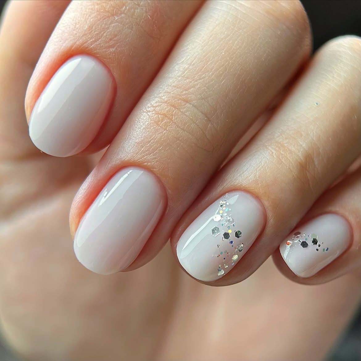 Milky White Oval Nails With Silver Glitter Accent