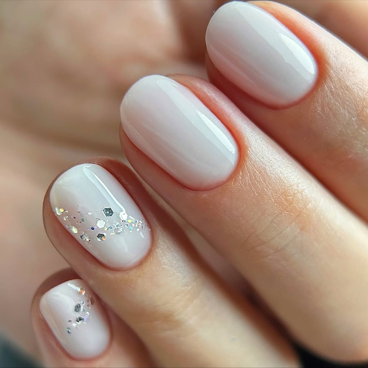 Milky White Winter Nails with Silver Glitter Accents