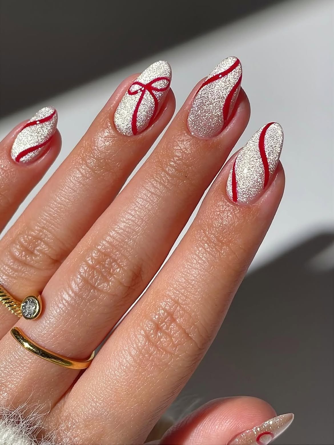 Silver Glitter Almond Nails with Red Bow Art