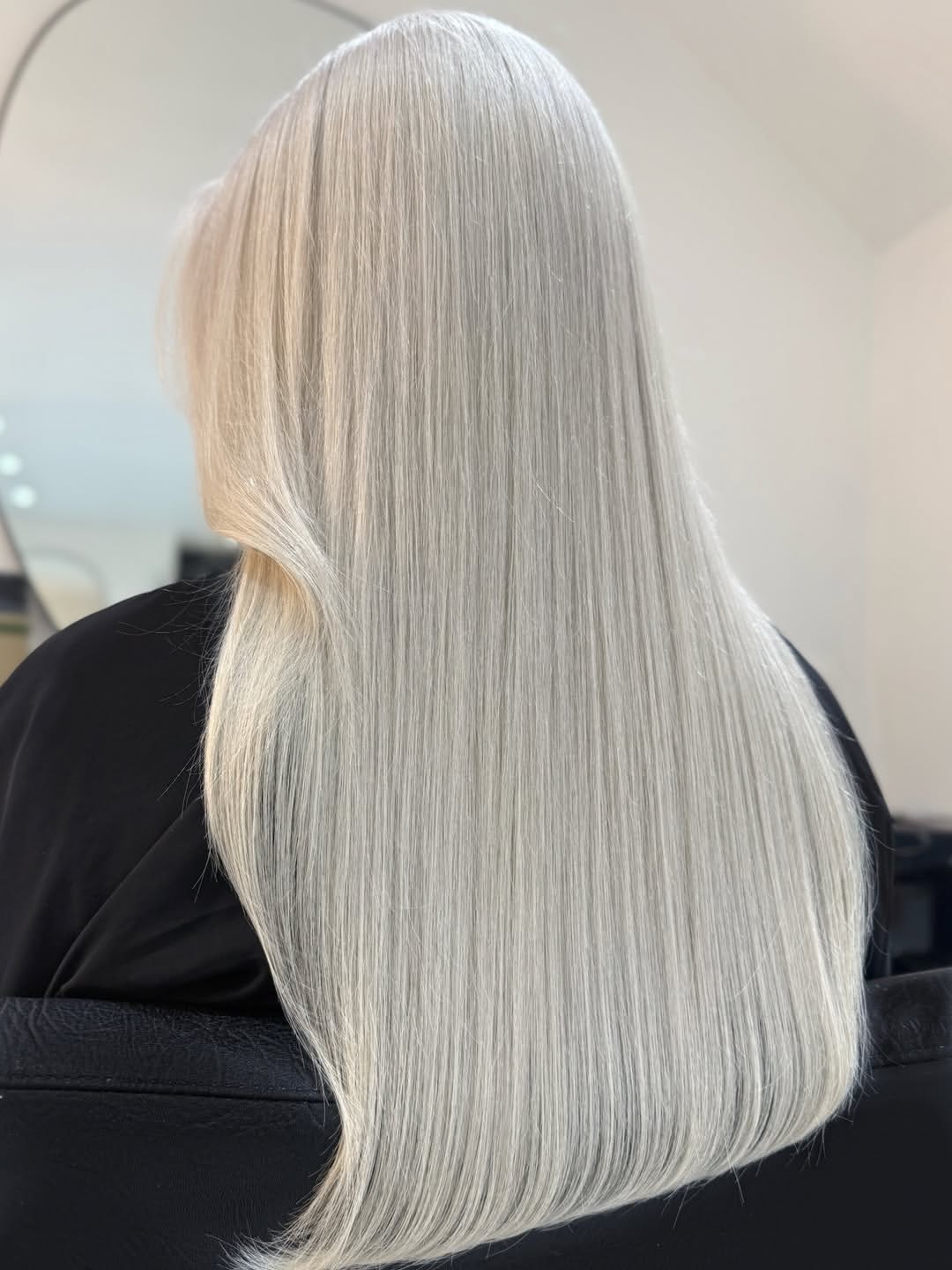 Sleek And Polished Long Platinum Blonde Hair