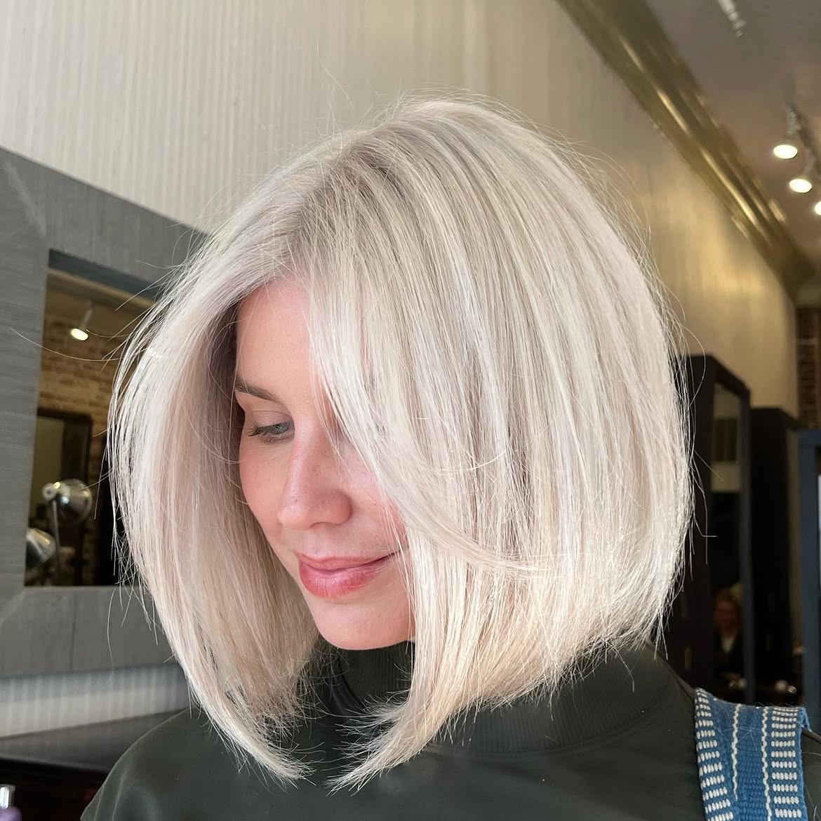 Sleek Platinum Blonde Bob With Face Framing Layers