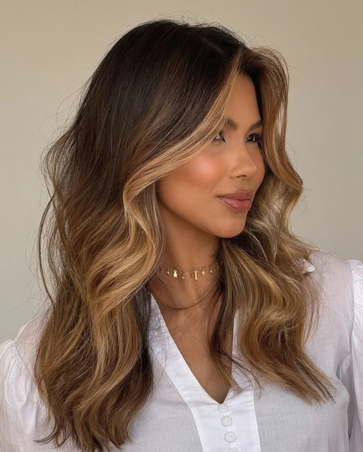 Soft Caramel Money Piece On Brunette Waves