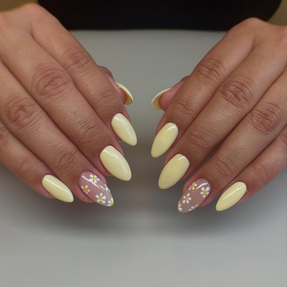 Soft Yellow Almond Nails with Daisy Accents