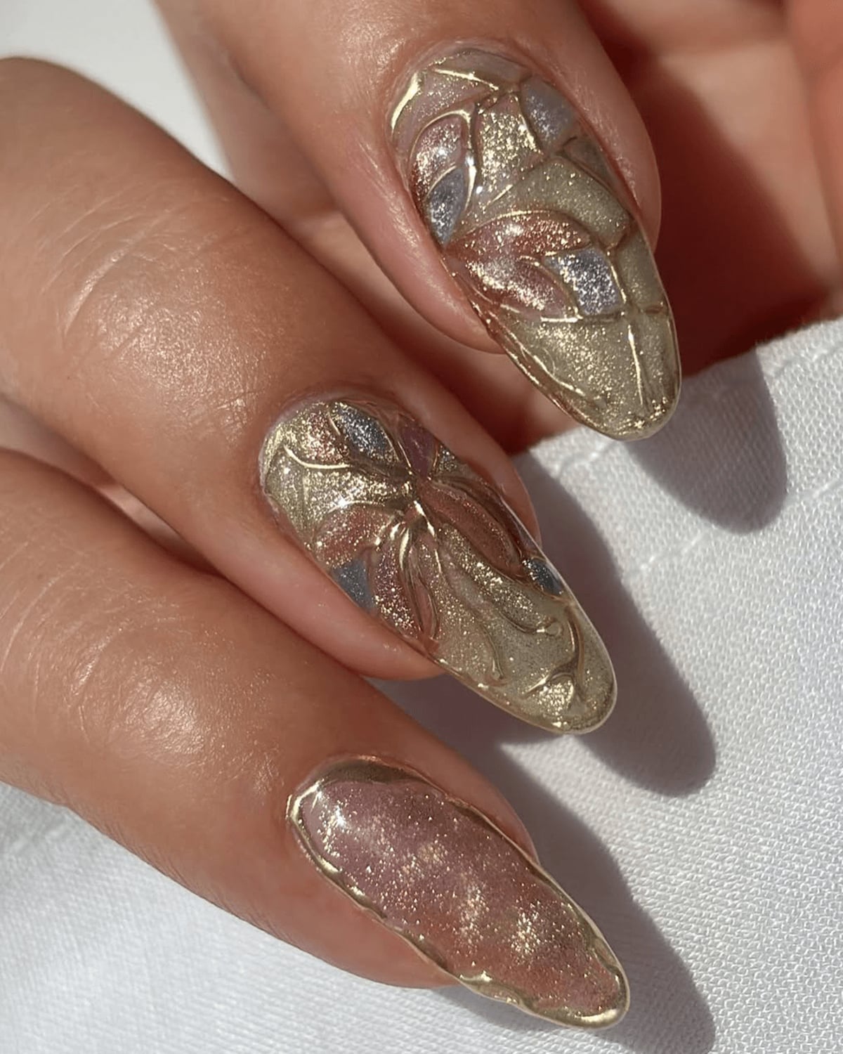 Long Almond Metallic Gold Nails with 3D Relief Designs Long Almond Metallic Gold Nails with 3D Relief Designs — 3D Nails