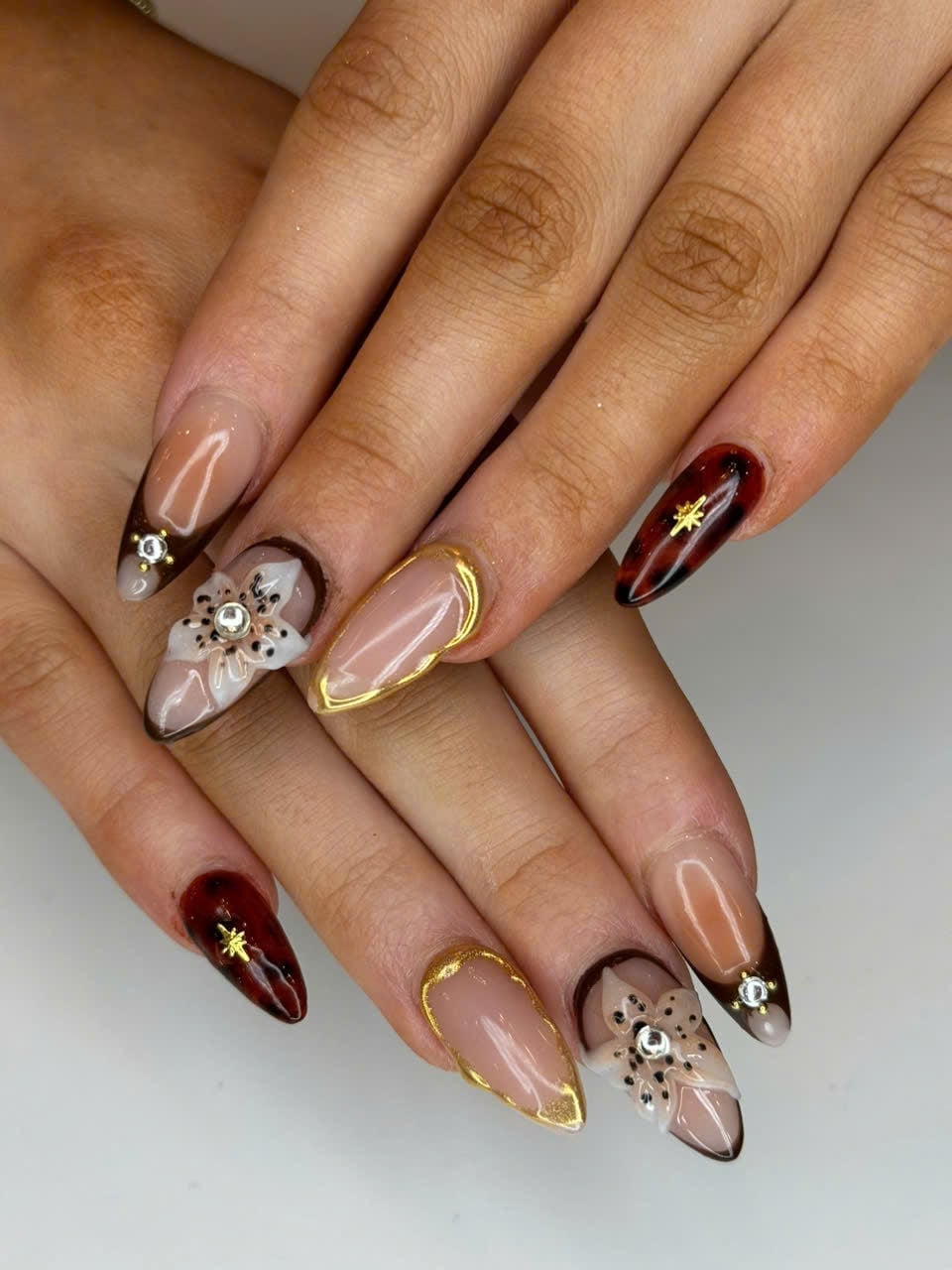 Medium Almond Nails with 3D Flowers and Brown French Tips Medium Almond Nails with 3D Flowers and Brown French Tips — 3D Nails