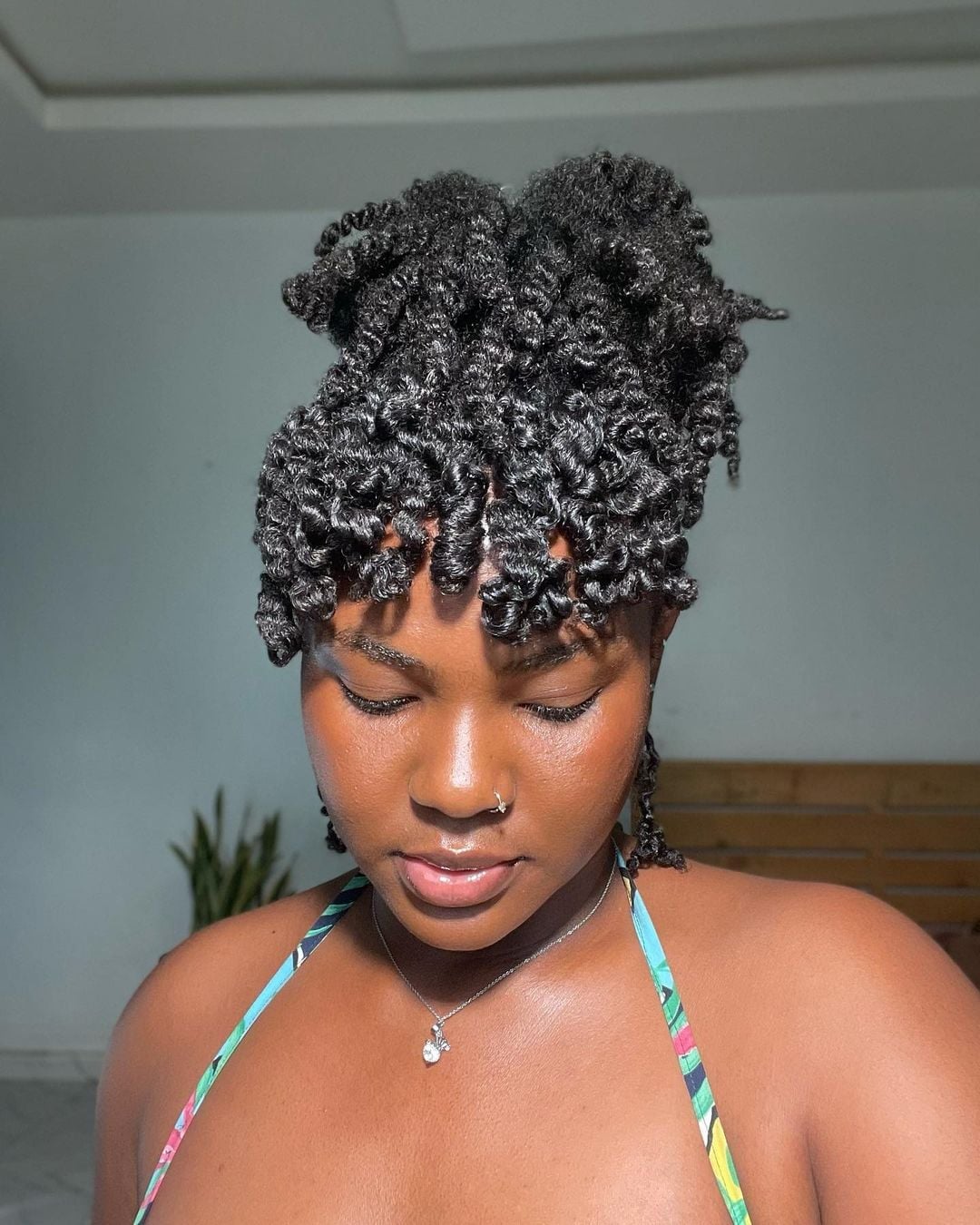 Twisted Updo With Coiled Bangs Twisted Updo With Coiled Bangs — Afro Hair