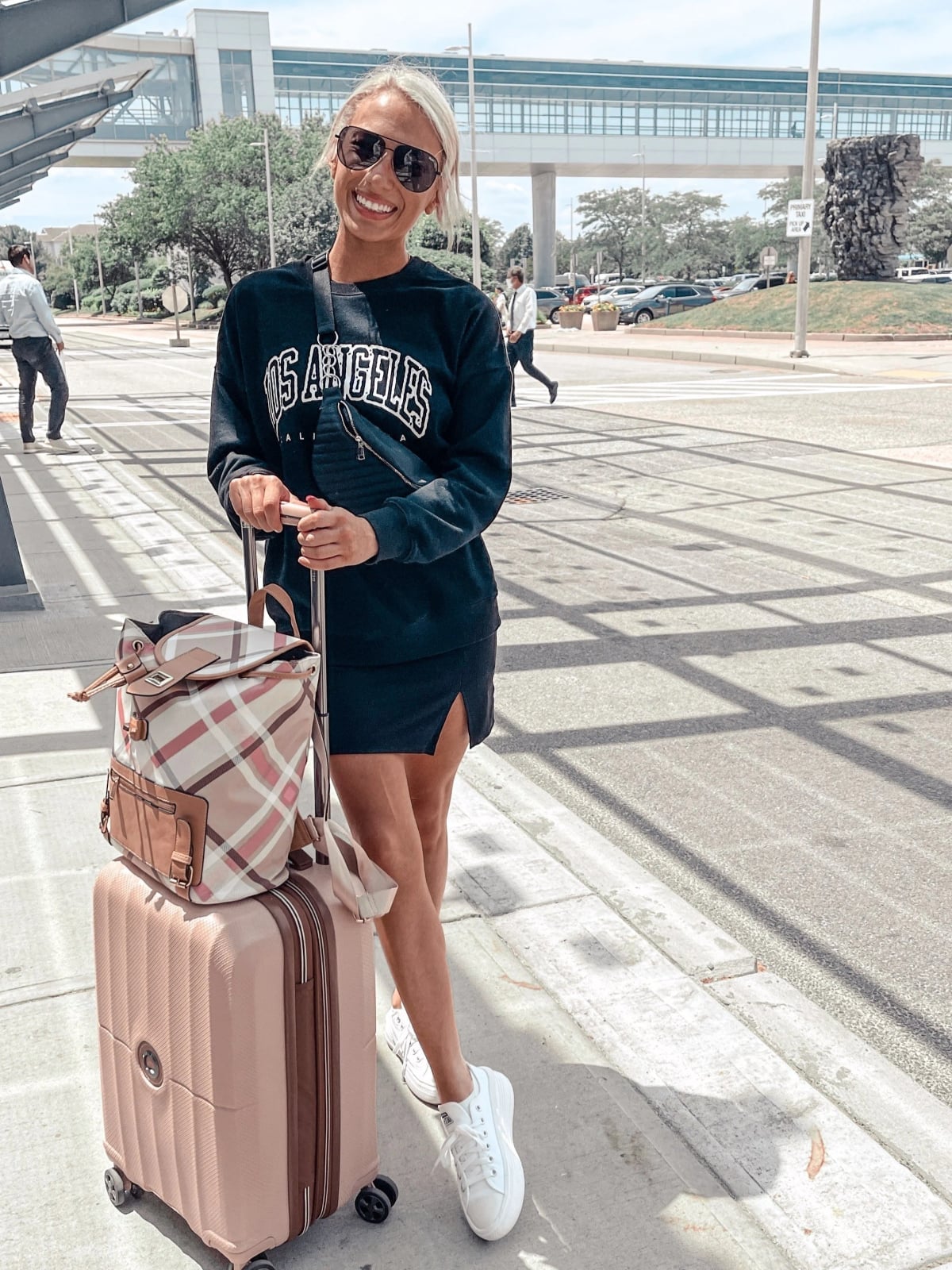 Black graphic sweatshirt with mini skirt Black graphic sweatshirt with mini skirt — Airport Outfits