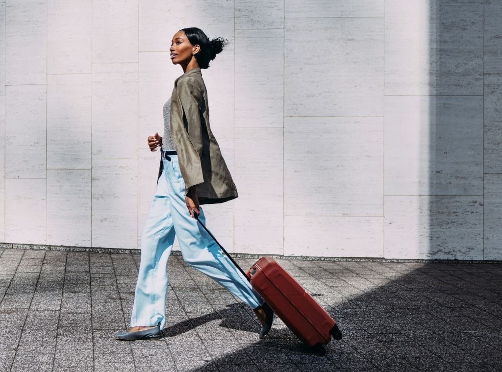 Olive green blazer with light blue wide-leg trousers Olive green blazer with light blue wide-leg trousers — Airport Outfits