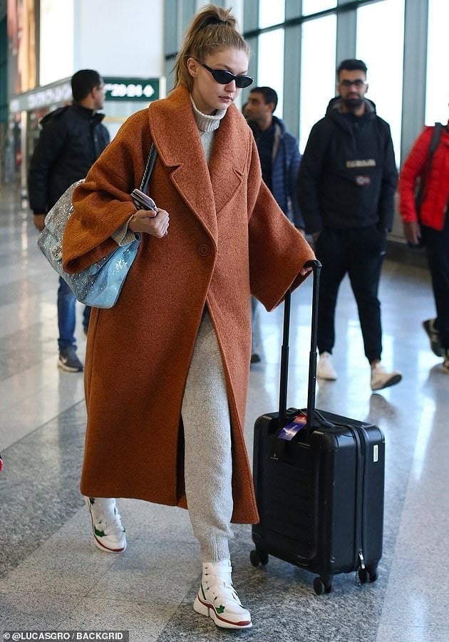 Rust coat over gray turtleneck and pants Rust coat over gray turtleneck and pants — Airport Outfits