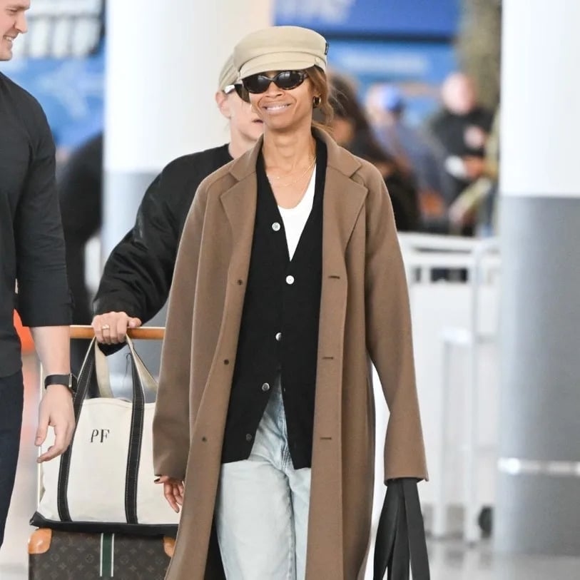 Long camel coat over black cardigan and jeans Long camel coat over black cardigan and jeans — Airport Outfits
