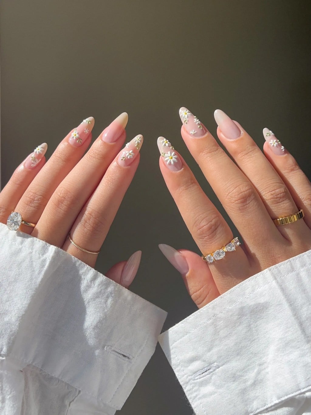 Sheer Nude Medium Almond Nails With 3D Florals Sheer Nude Medium Almond Nails With 3D Florals