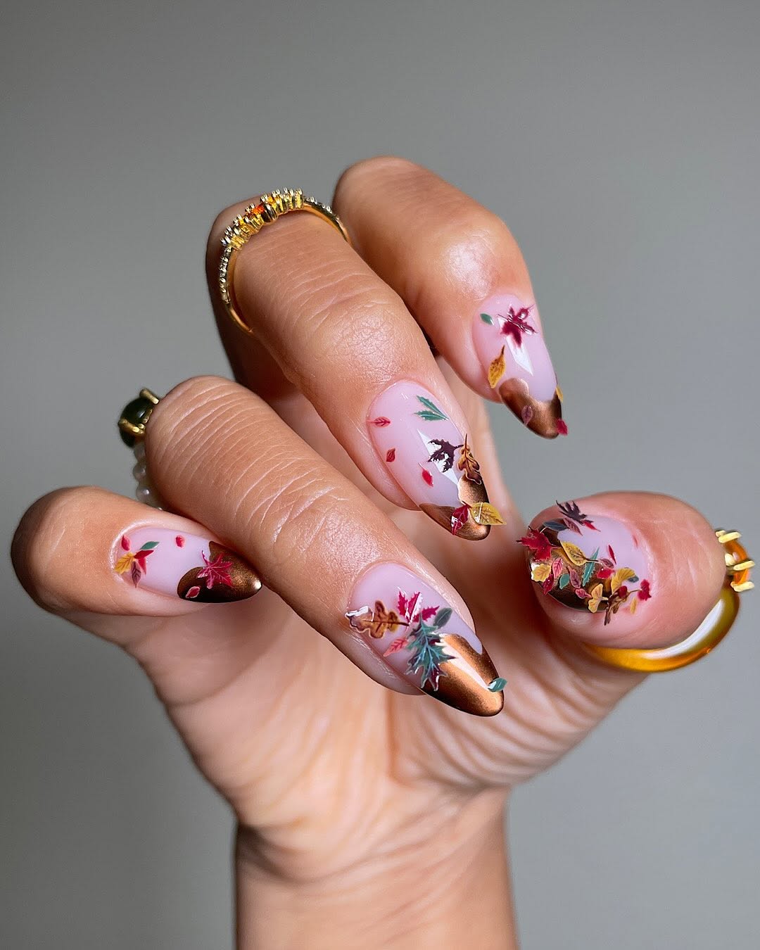 Sheer Pink Long Almond Nails With Leaf Motifs Sheer Pink Long Almond Nails With Leaf Motifs