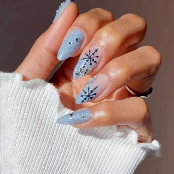Light Blue Shimmer Stiletto Nails with Snowflakes Light Blue Shimmer Stiletto Nails with Snowflakes — Baby Blue Nails