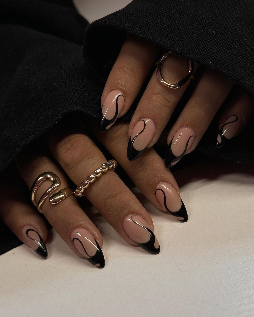 Glossy Nude Nails with Black Curved Lines Glossy Nude Nails with Black Curved Lines — Baddie Nails