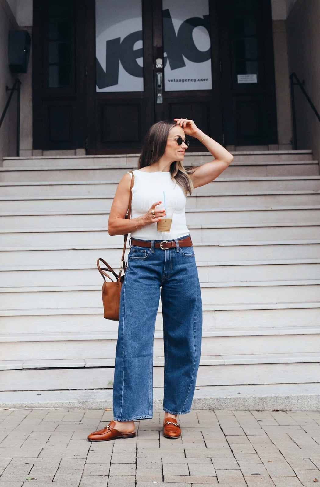 White Sleeveless Top With Medium Wash Barrel Jeans White Sleeveless Top With Medium Wash Barrel Jeans — Barrel Jeans Outfits