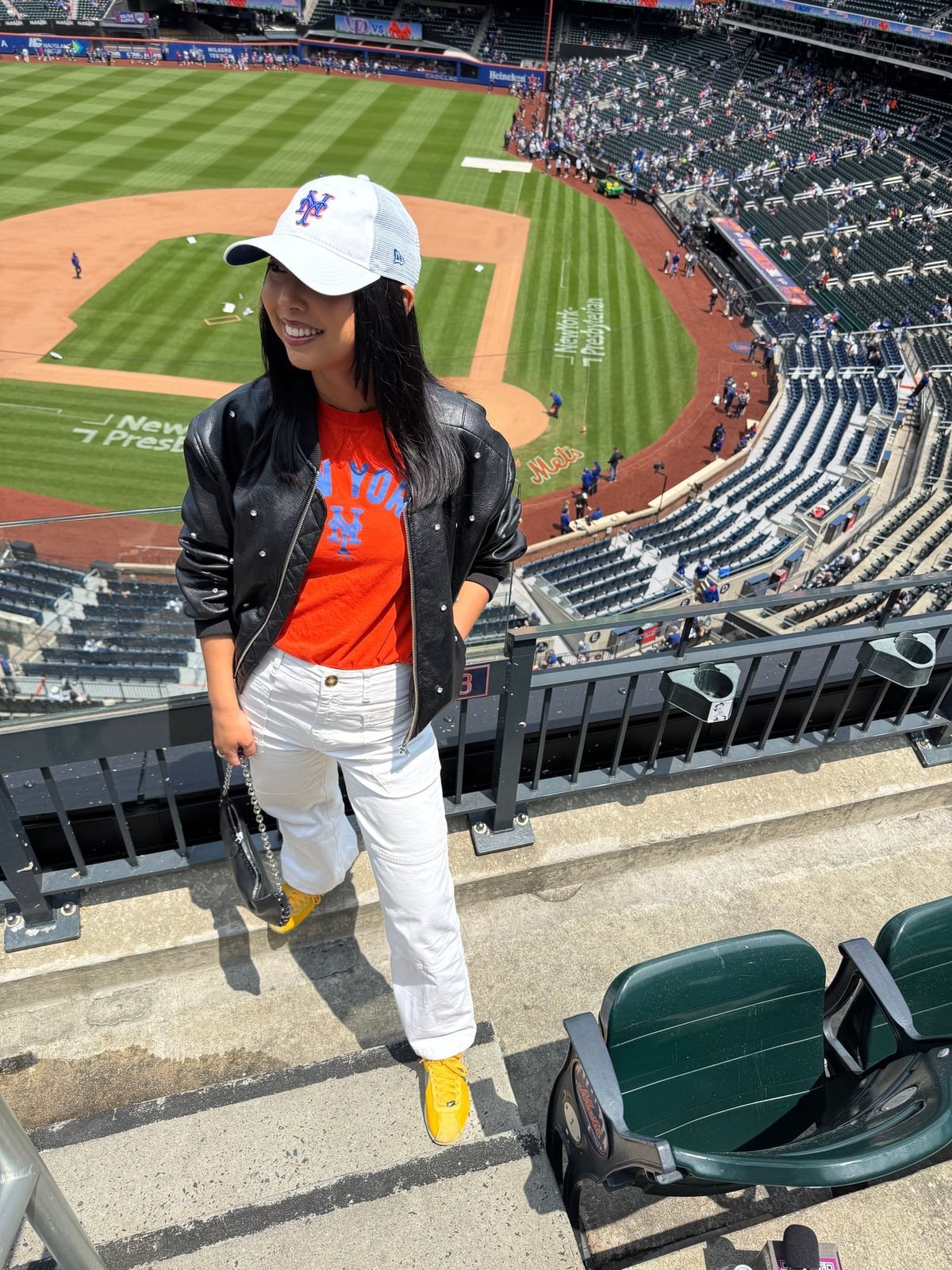 Studded Bomber Jacket With Orange T-Shirt And White Pants Studded Bomber Jacket With Orange T-Shirt And White Pants — Baseball Game Outfits