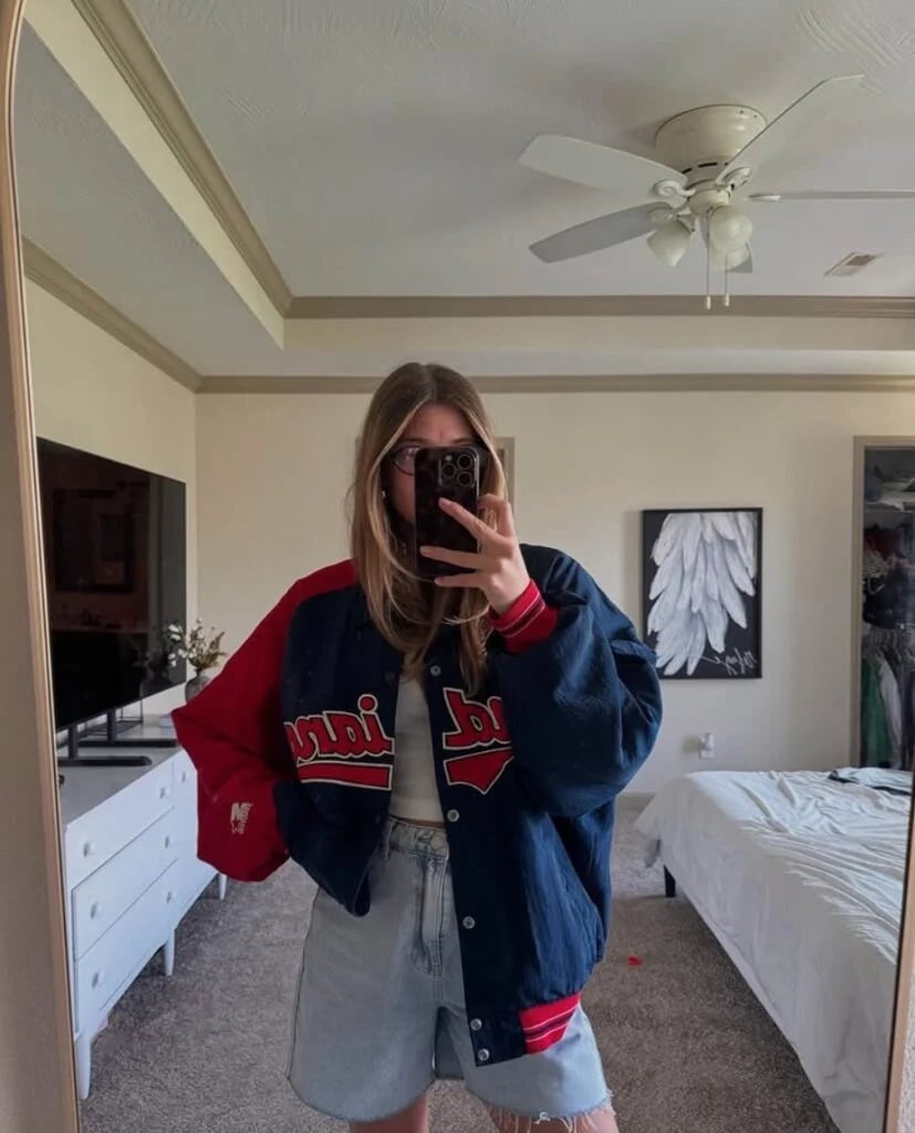 Oversized Baseball Jacket With White Top And Denim Shorts Oversized Baseball Jacket With White Top And Denim Shorts — Baseball Game Outfits