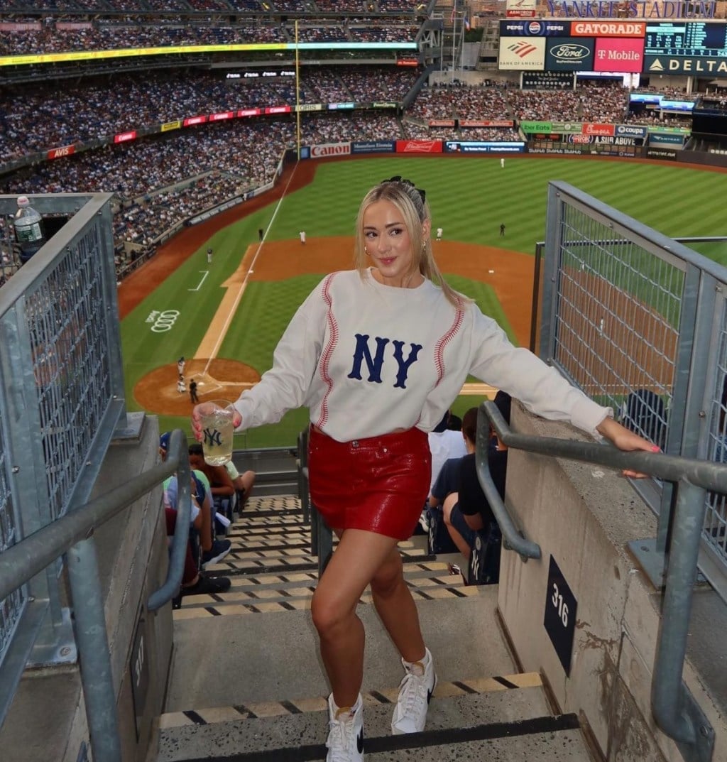 Cream NY Sweatshirt With Red Faux Leather Mini Skirt Cream NY Sweatshirt With Red Faux Leather Mini Skirt — Baseball Game Outfits