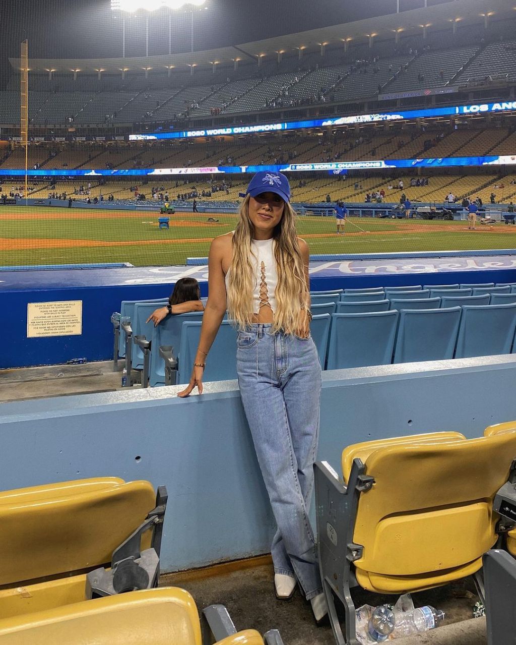 Laced Crop Top With Wide-Leg Jeans And Baseball Cap Laced Crop Top With Wide-Leg Jeans And Baseball Cap — Baseball Game Outfits
