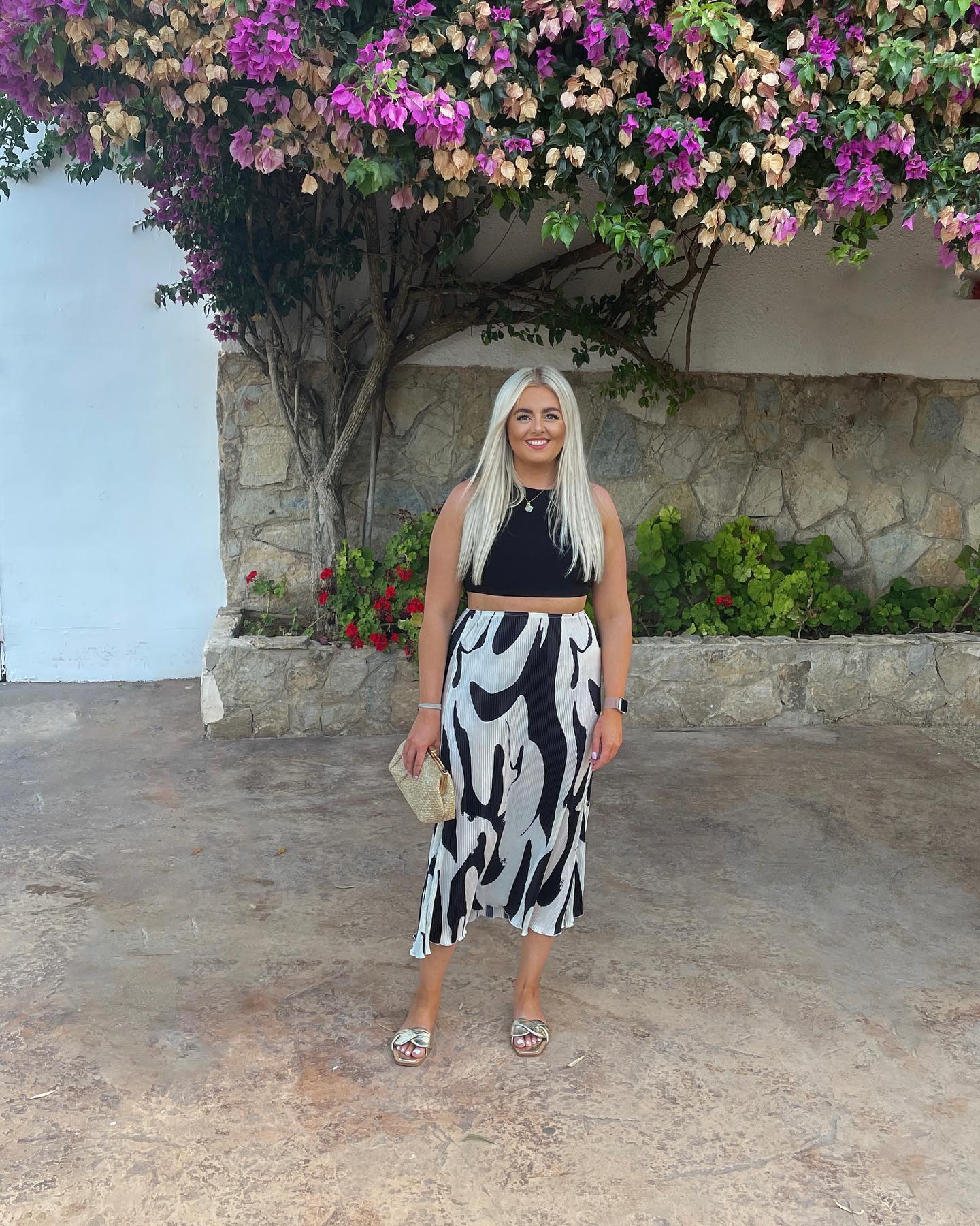 Black Crop Top And Printed Midi Skirt Vacation Look