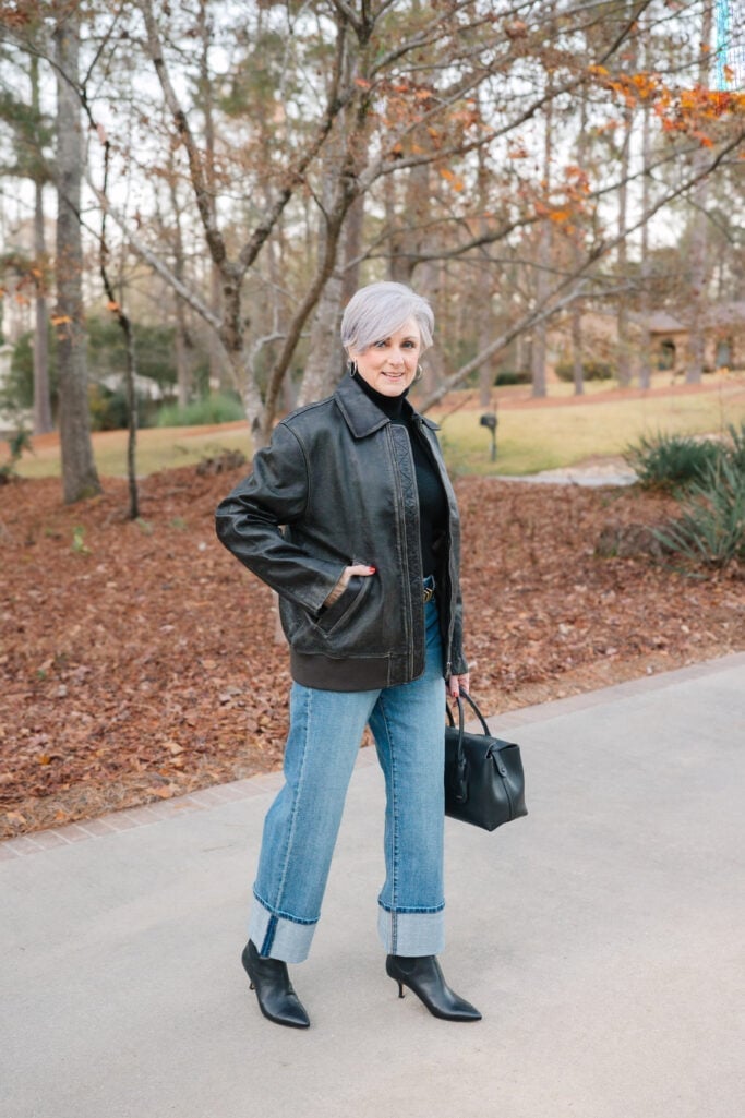 Oversized Black Leather Jacket With Blue Jeans, Close-Up Take Oversized Black Leather Jacket With Blue Jeans, Close-Up Take — Black Jacket Outfit