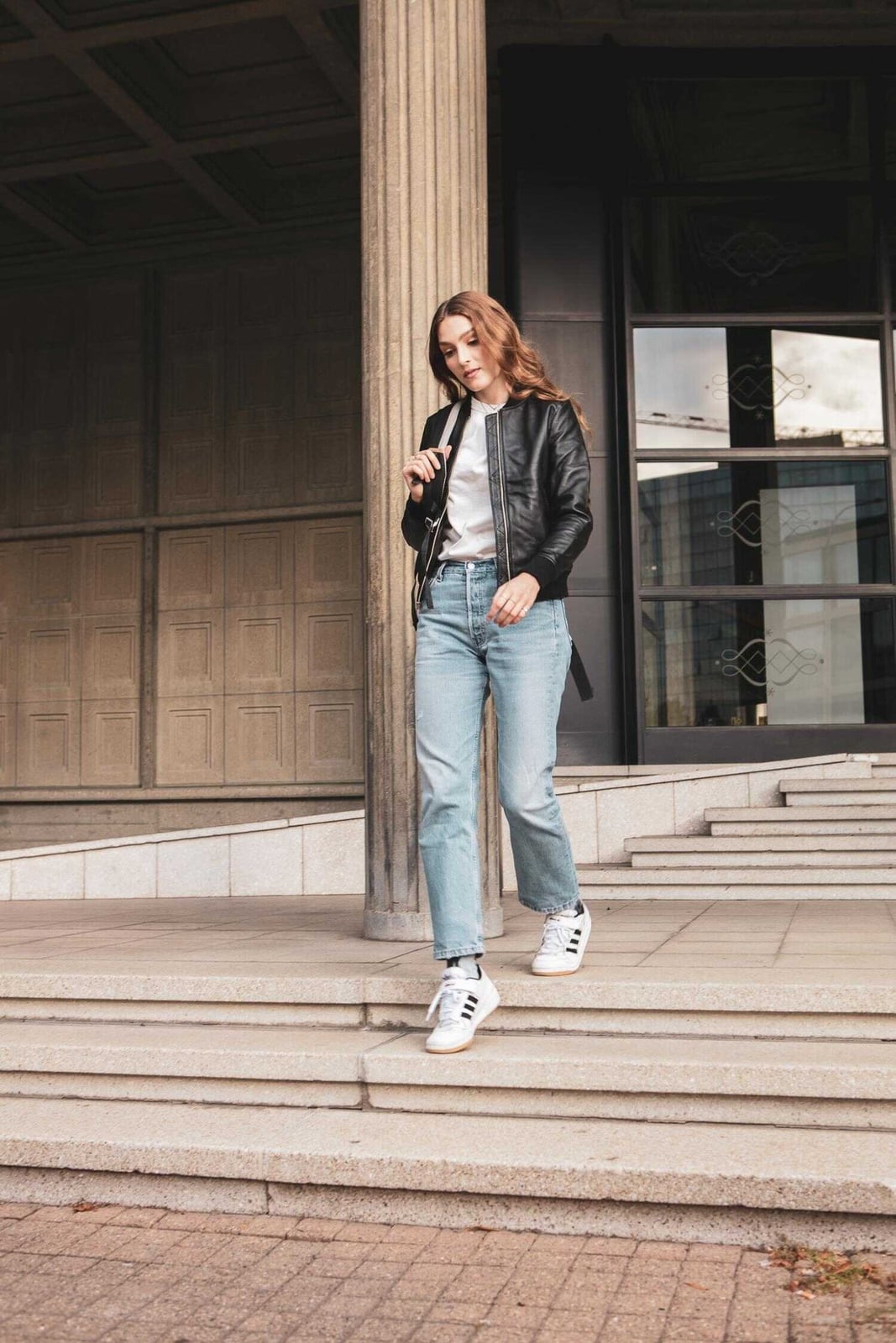 Fitted Black Leather Jacket With Straight Leg Jeans, Close-Up Take Fitted Black Leather Jacket With Straight Leg Jeans, Close-Up Take — Black Jacket Outfit