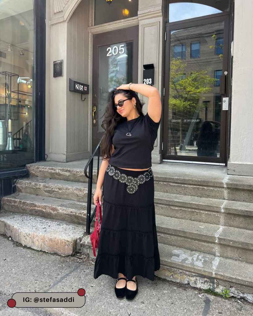 Black Tiered Maxi Skirt With Black T-Shirt And Red Handbag Black Tiered Maxi Skirt With Black T-Shirt And Red Handbag — Black Skirt Outfit