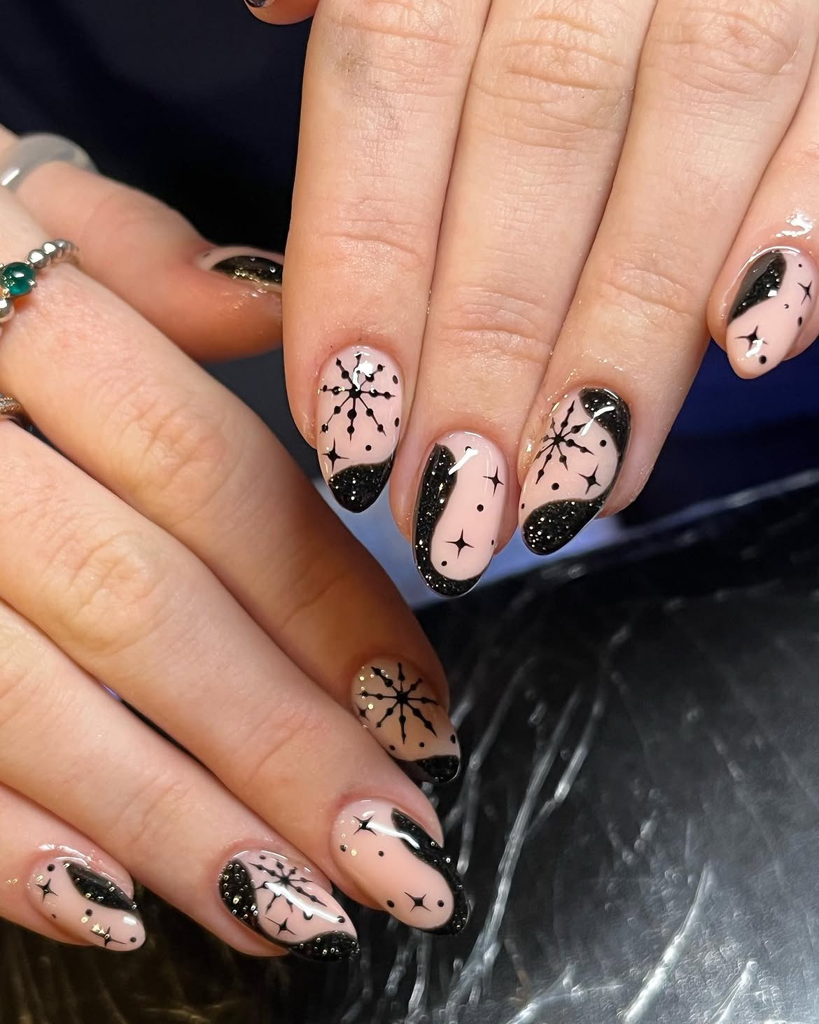 Black Starburst & Glitter Swirl Almond Nails