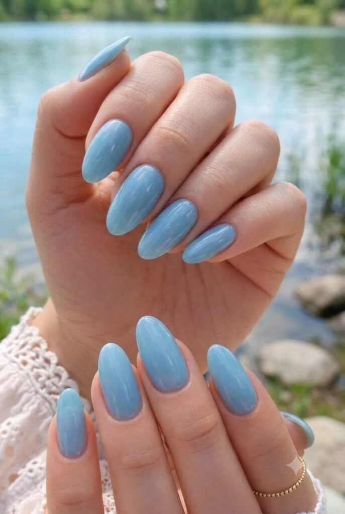Milky Light Blue Glossy Short Almond Nails, Close-Up Take Milky Light Blue Glossy Short Almond Nails, Close-Up Take — Blue Almond Nails