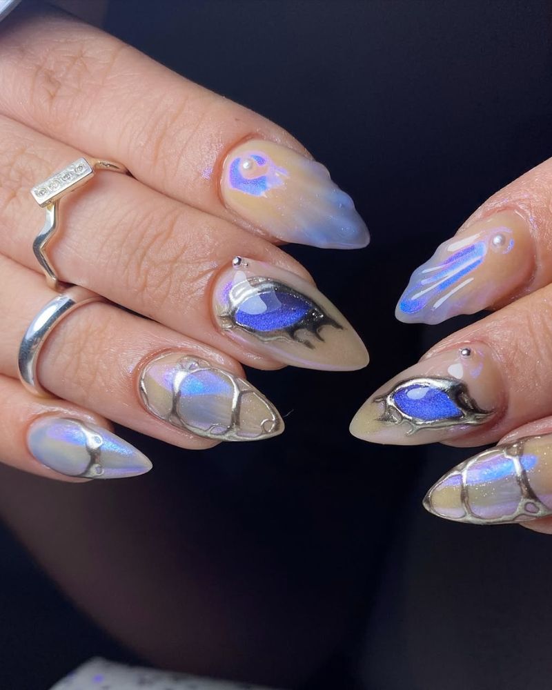 Blue Inset Eye Design Silver Trim Almonds Blue Inset Eye Design Silver Trim Almonds — Blue Chrome Nails