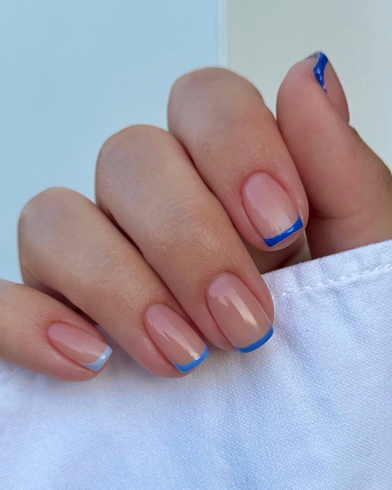 Distinct Light Blue French Tips Medium Oval Nails Distinct Light Blue French Tips Medium Oval Nails — Blue French Tip Nails