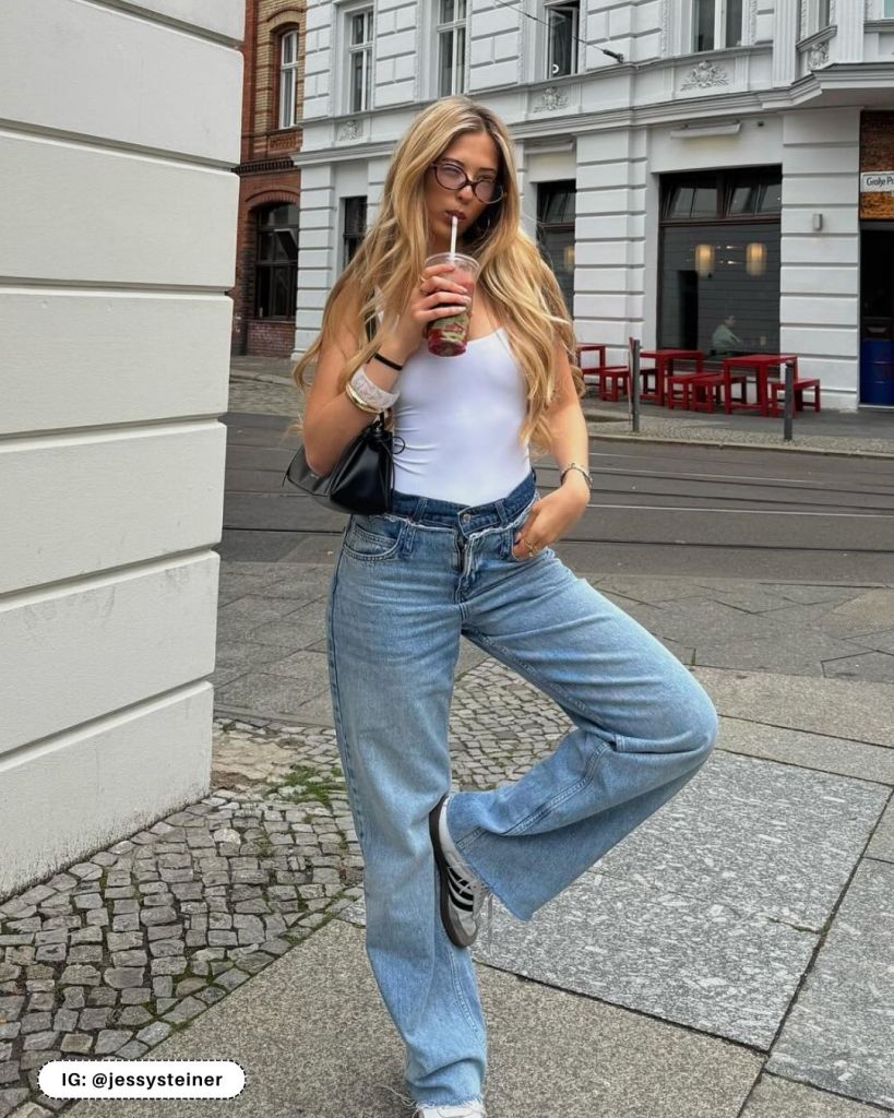 Light blue baggy jeans with a white tank top and gray sneakers Light blue baggy jeans with a white tank top and gray sneakers — Blue Jeans Outfits