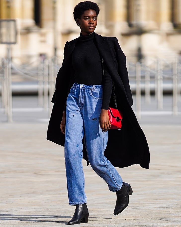 Ripped light blue jeans with a black turtleneck and long black coat Ripped light blue jeans with a black turtleneck and long black coat — Blue Jeans Outfits