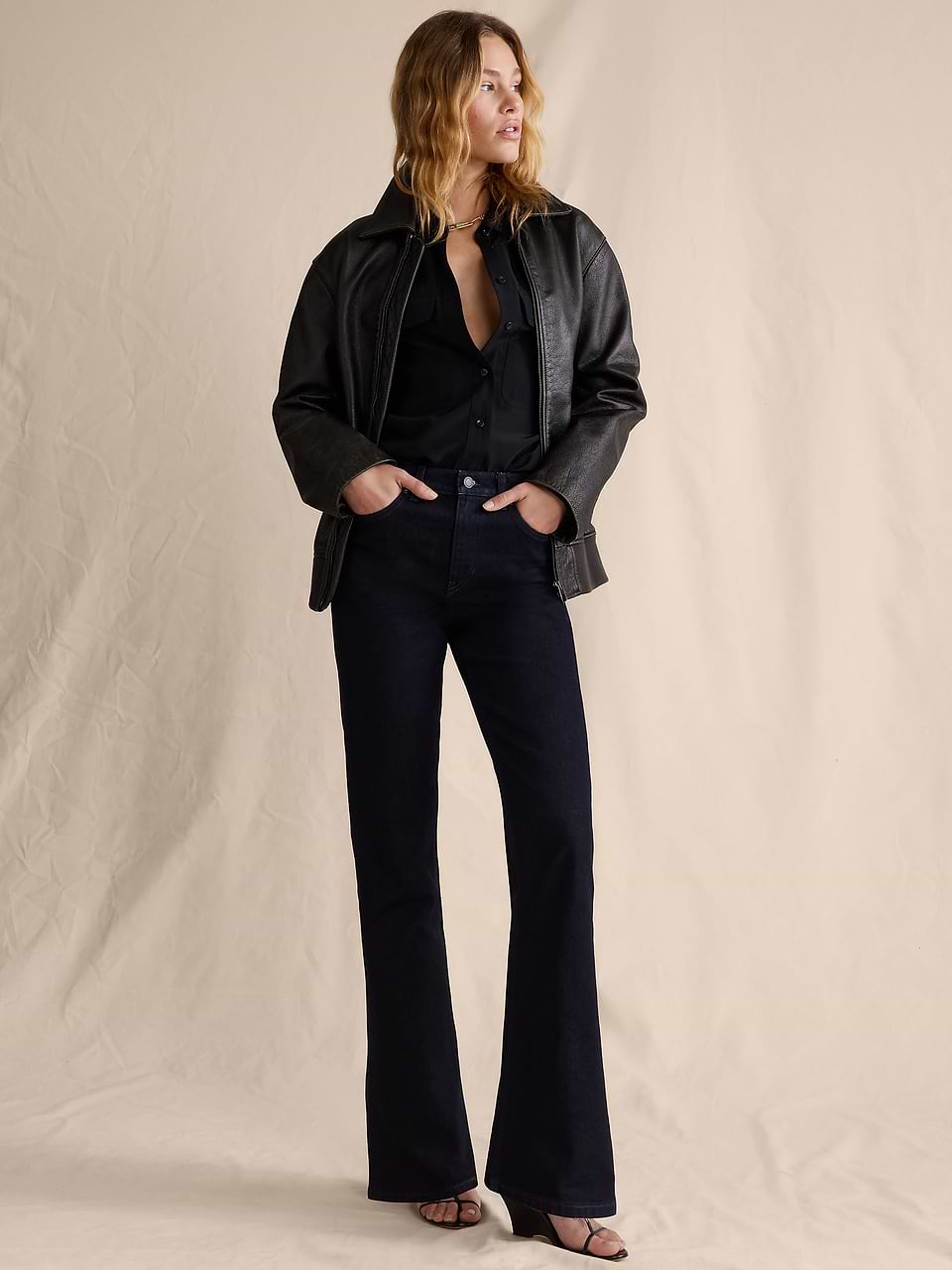 Dark wash bootcut jeans with a black leather jacket and button-down Dark wash bootcut jeans with a black leather jacket and button-down — Bootcut Jeans Outfits