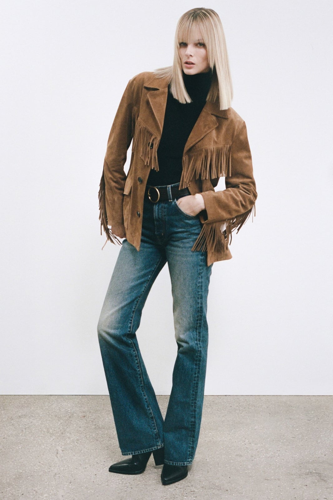 Medium wash bootcut jeans with a black turtleneck and suede jacket Medium wash bootcut jeans with a black turtleneck and suede jacket — Bootcut Jeans Outfits