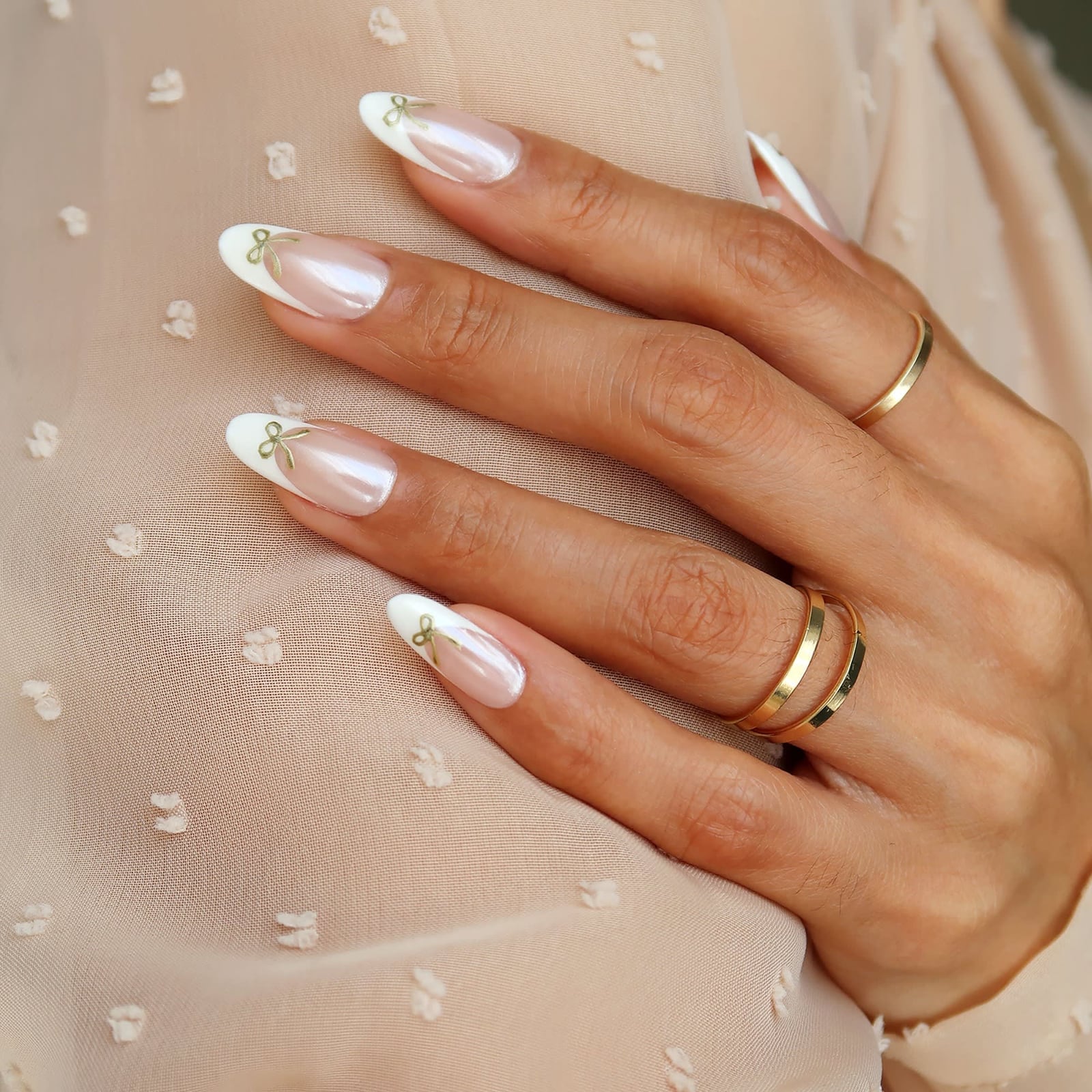 Milky Pearlescent Medium Almond Nails With Gold Bows Milky Pearlescent Medium Almond Nails With Gold Bows — Bow Nails