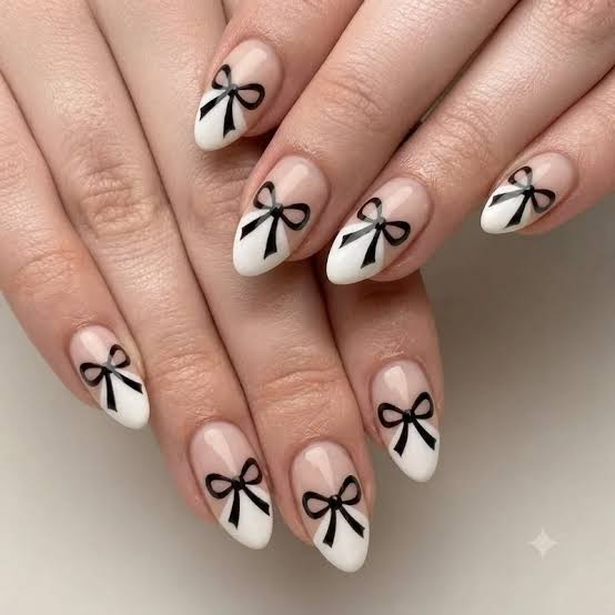Sheer Nude Black Bow Medium Almond Nails Sheer Nude Black Bow Medium Almond Nails — Bow Nails