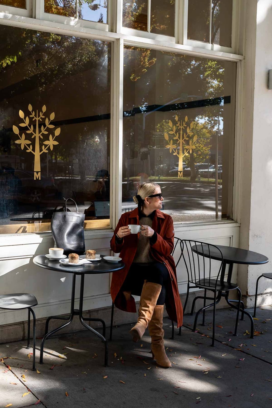 Tan suede knee-high boots with rust coat and black trousers Tan suede knee-high boots with rust coat and black trousers — Brown Boots Outfit