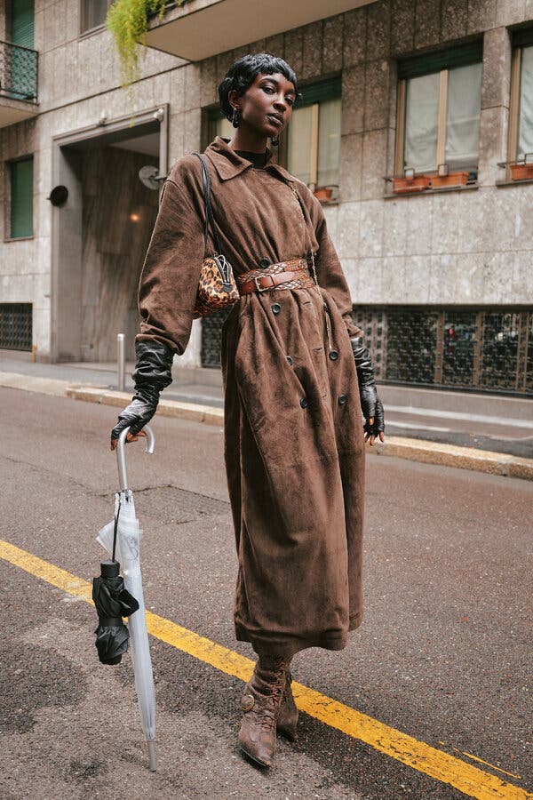 Long brown suede coat anchors an elegant ensemble Long brown suede coat anchors an elegant ensemble — Brown Jacket Outfit