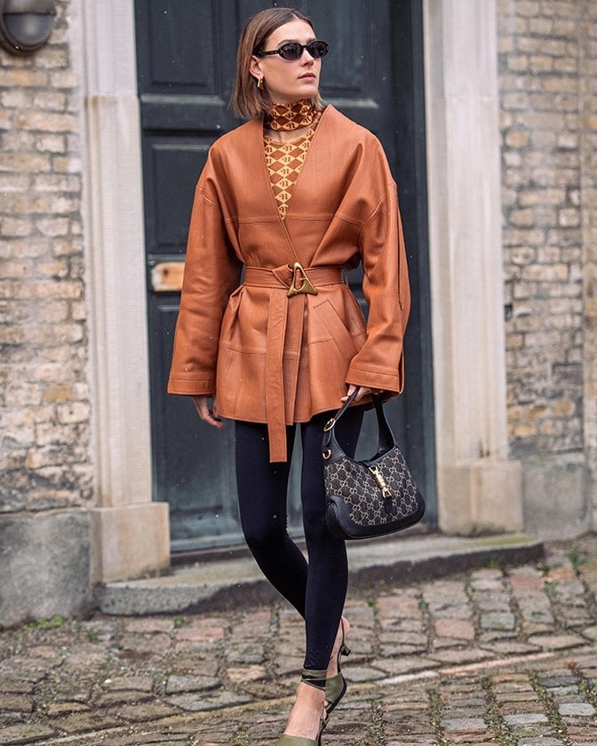 Brown Leather Wrap Jacket With Black Leggings And Green Heels Brown Leather Wrap Jacket With Black Leggings And Green Heels — Brown Leather Jacket Outfit