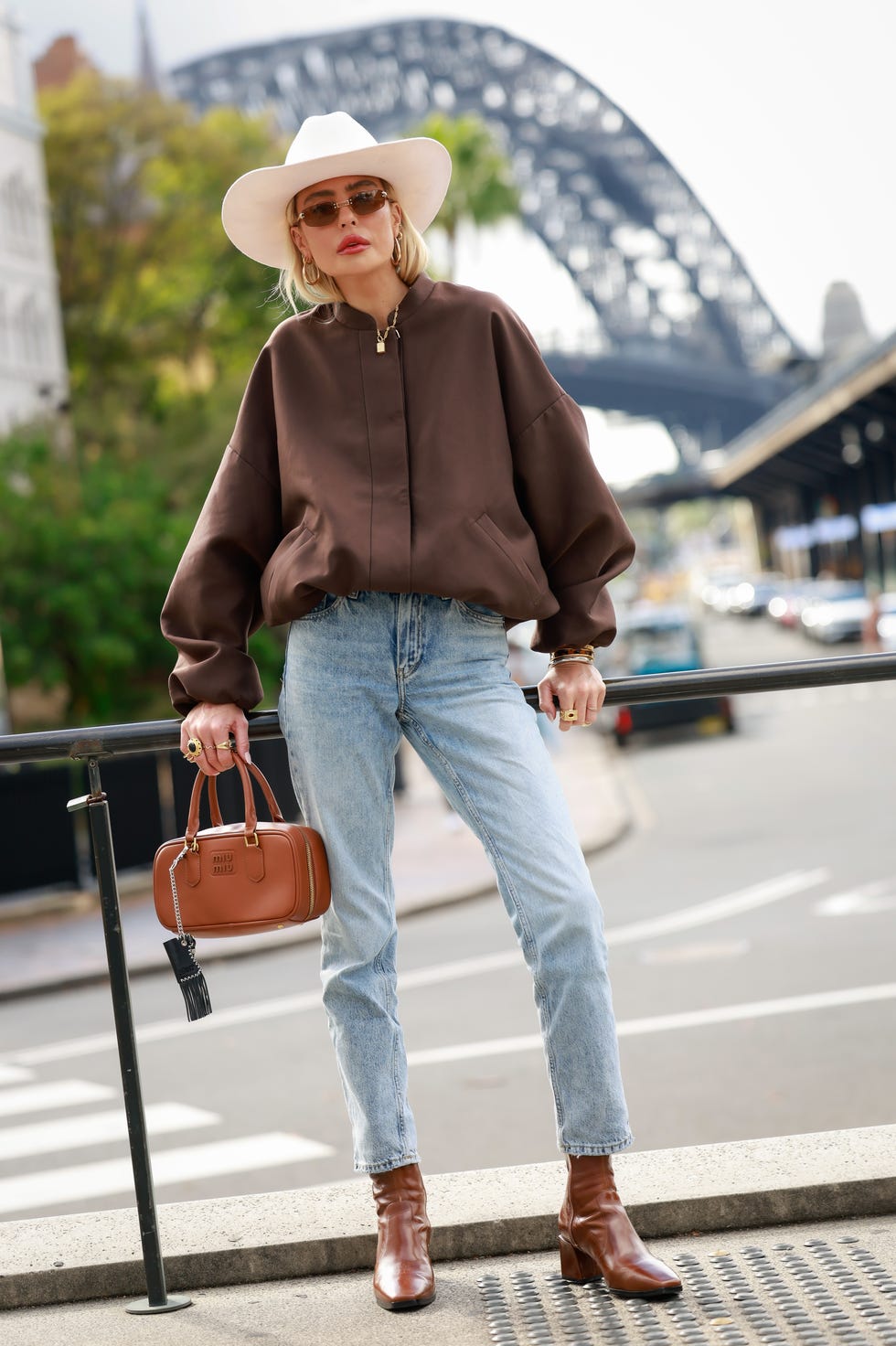 Casual Brown Bomber Jacket Over Light Top and Jeans Casual Brown Bomber Jacket Over Light Top and Jeans — Brown Top Outfits