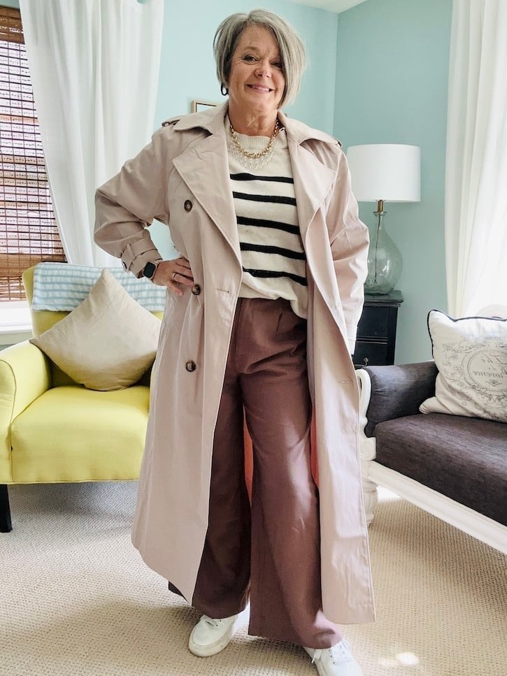 Beige Trench Coat Over Striped Sweater And Trousers Beige Trench Coat Over Striped Sweater And Trousers — Brown Trousers Outfit