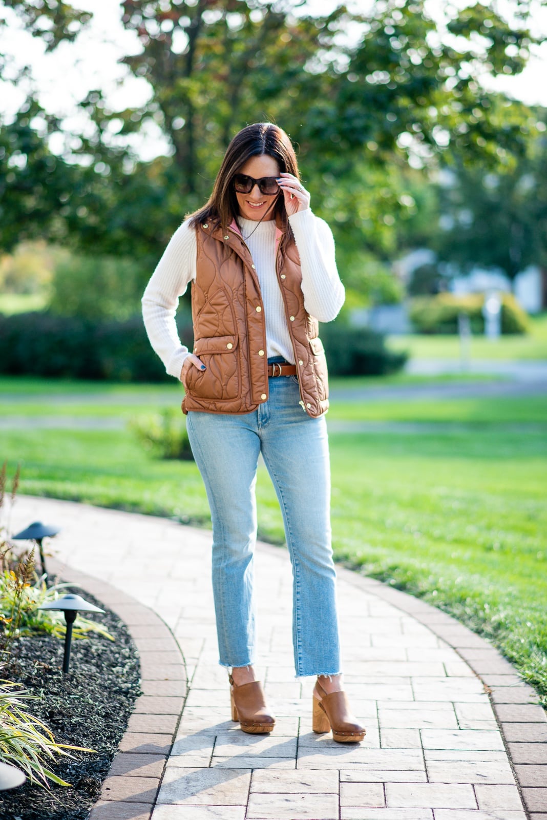 Brown quilted puffer vest over white sweater and jeans, Close-Up Take Brown quilted puffer vest over white sweater and jeans, Close-Up Take — Brown Vest Outfit