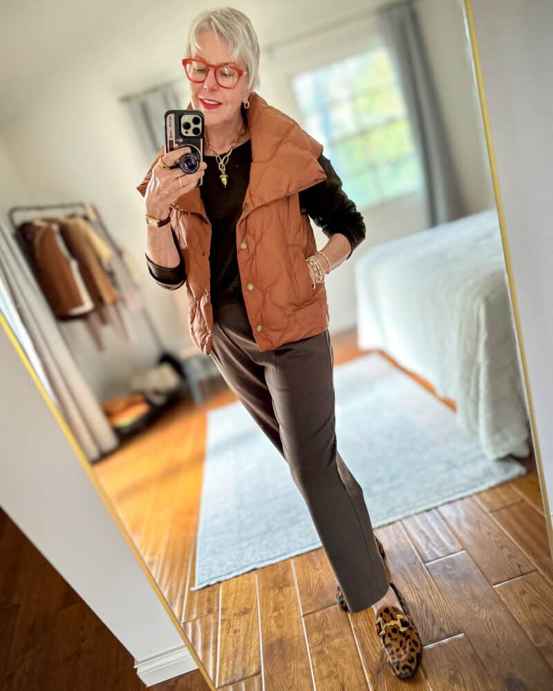 Brown quilted puffer vest with high collar over dark top Brown quilted puffer vest with high collar over dark top — Brown Vest Outfit